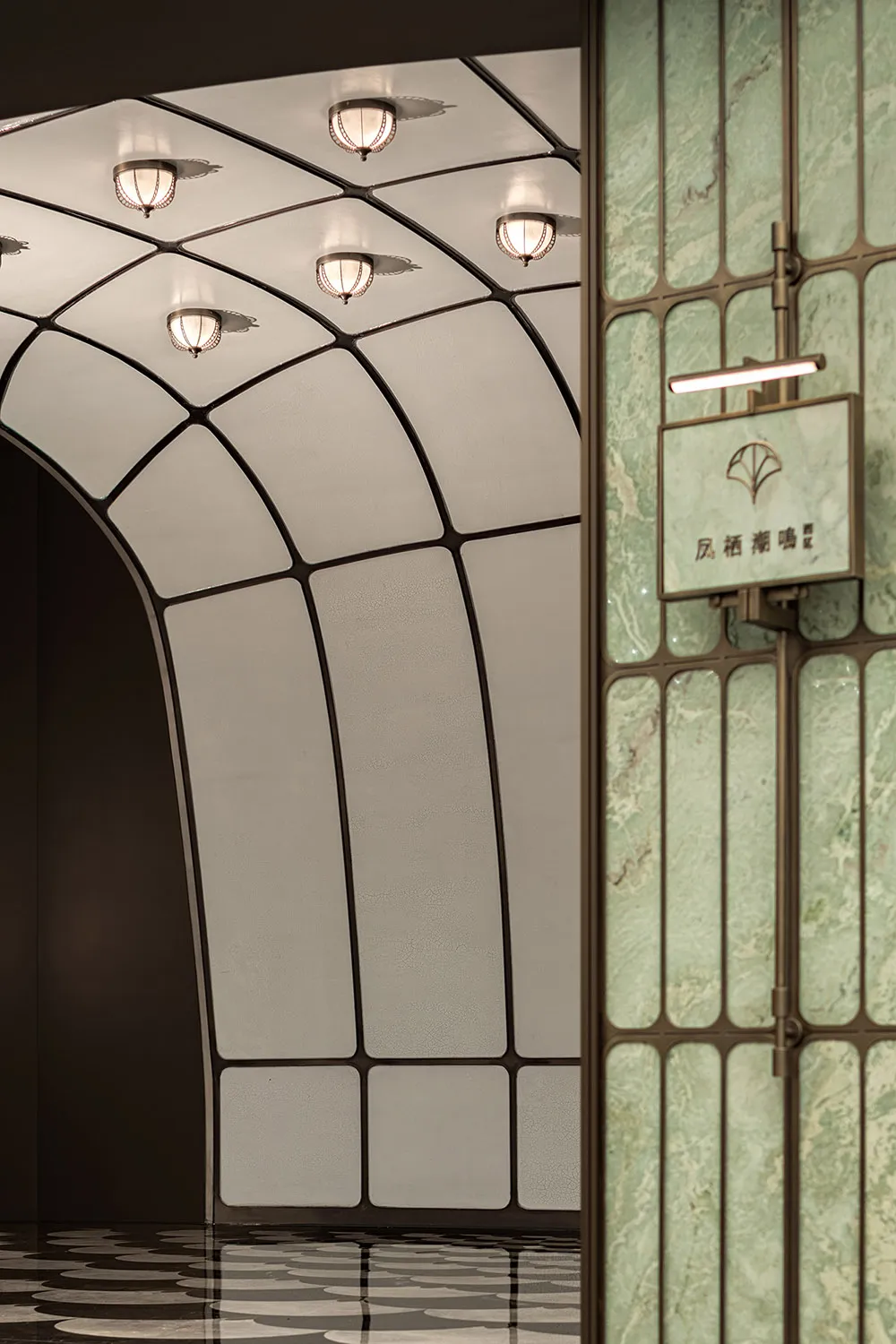 A bright and welcoming entrance hallway with marble flooring, clean lines, and modern design elements
