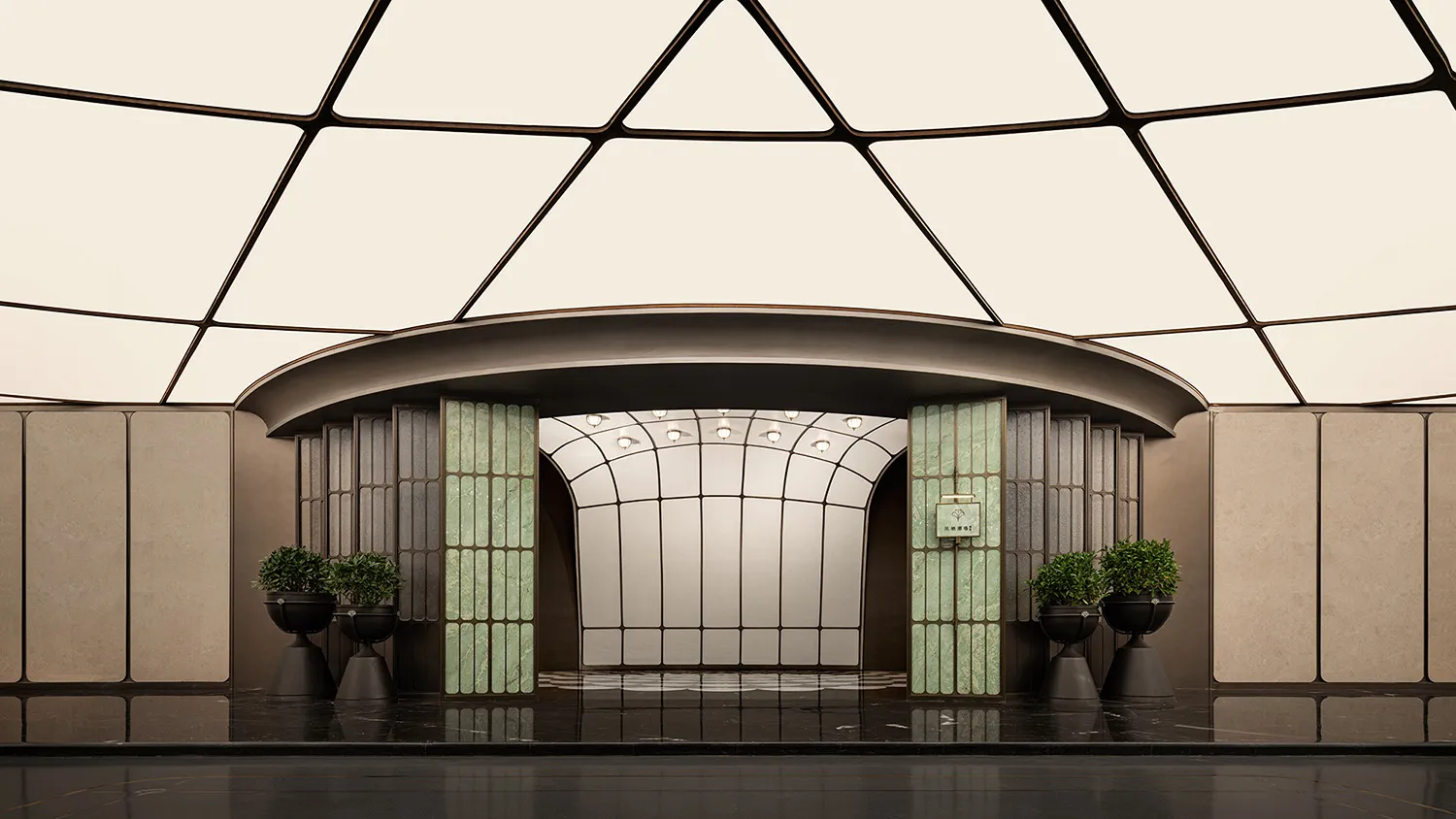 A grand hallway with a high ceiling, two potted plants, and a sense of elegance and spaciousness