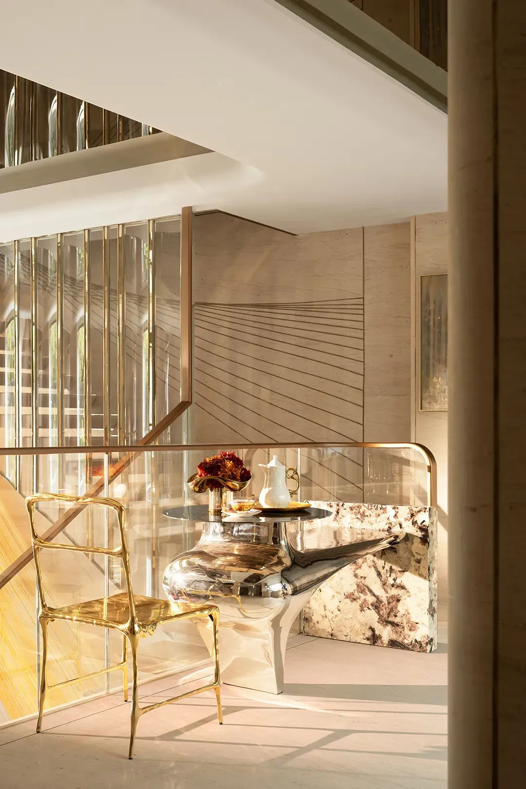 Dining room with a wooden table and chairs, a vase, and a couch, creating a comfortable and inviting atmosphere