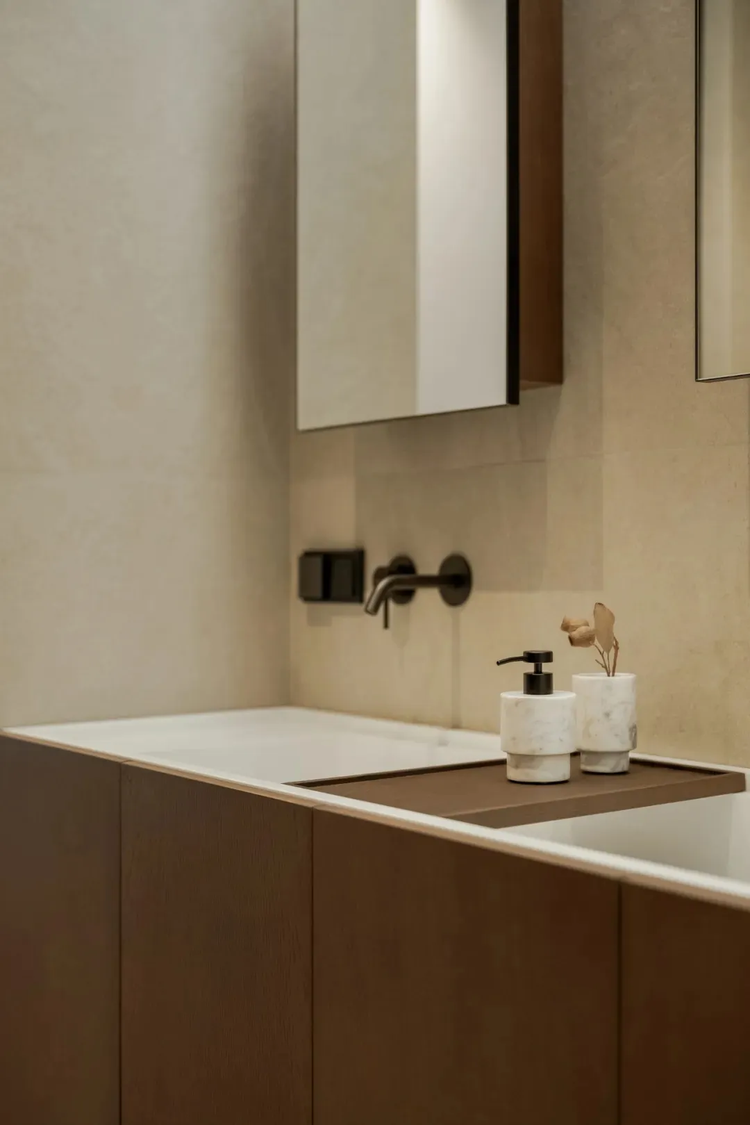 Bathroom with a marble sink, modern fixtures, and a sleek design