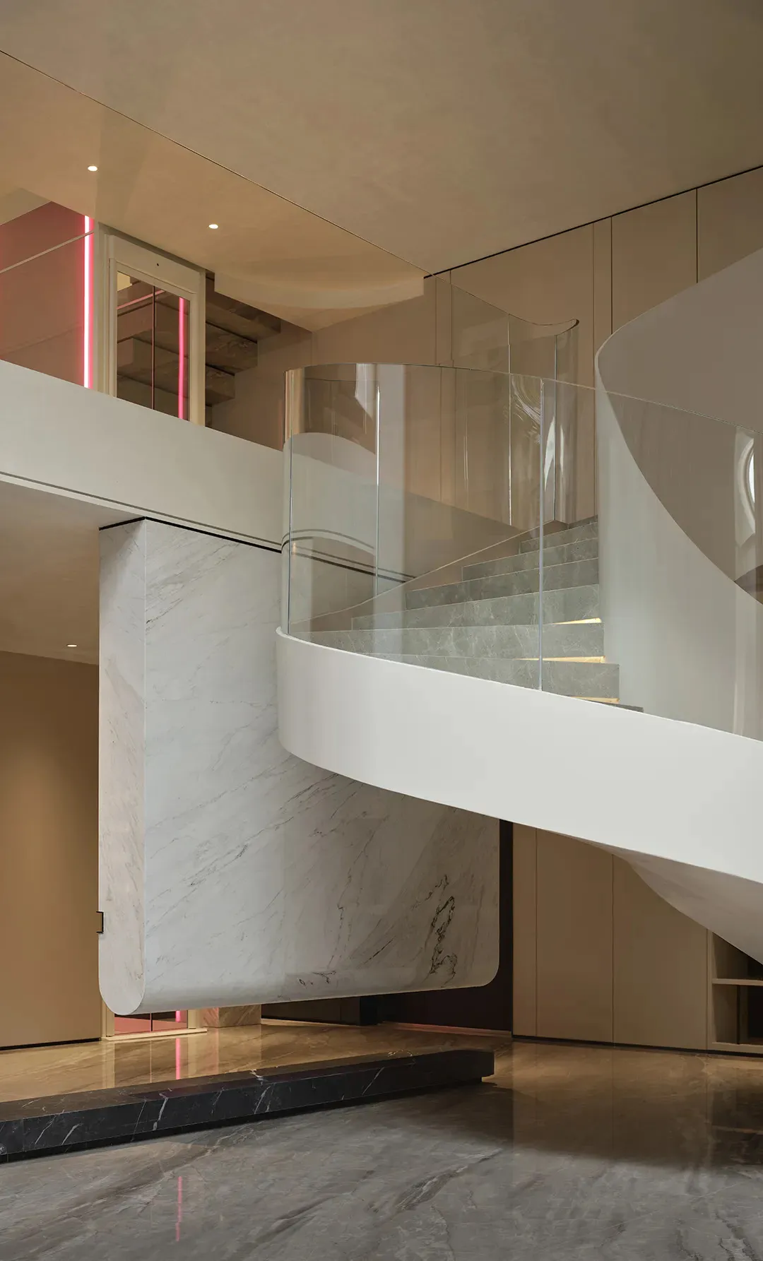 A spiral staircase in a well-lit stairwell, made of marble, in a modern building with clean lines and minimalistic elements