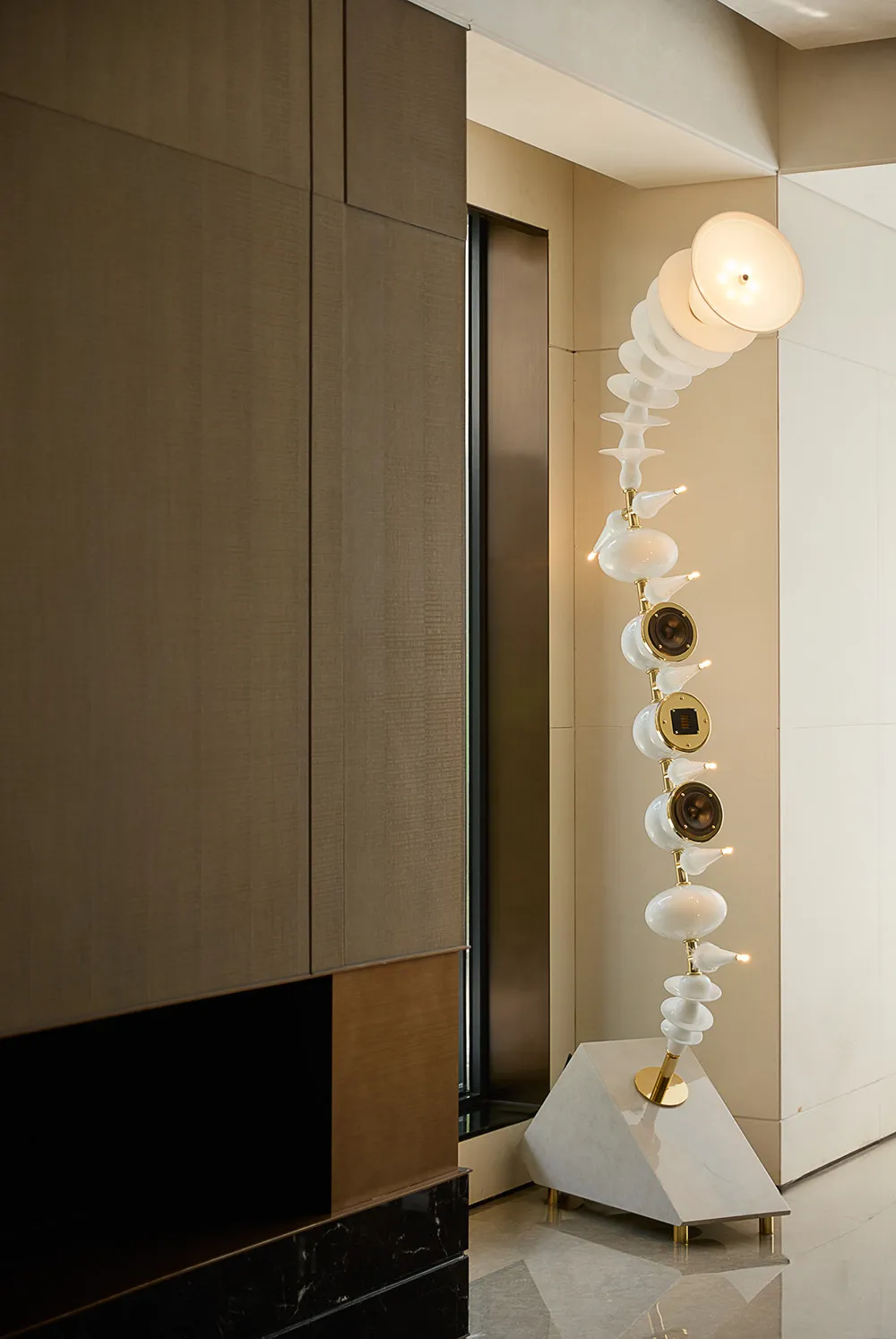 An arrangement of white ceramic vases in various shapes and sizes on a table, showcasing intricate details and creative composition