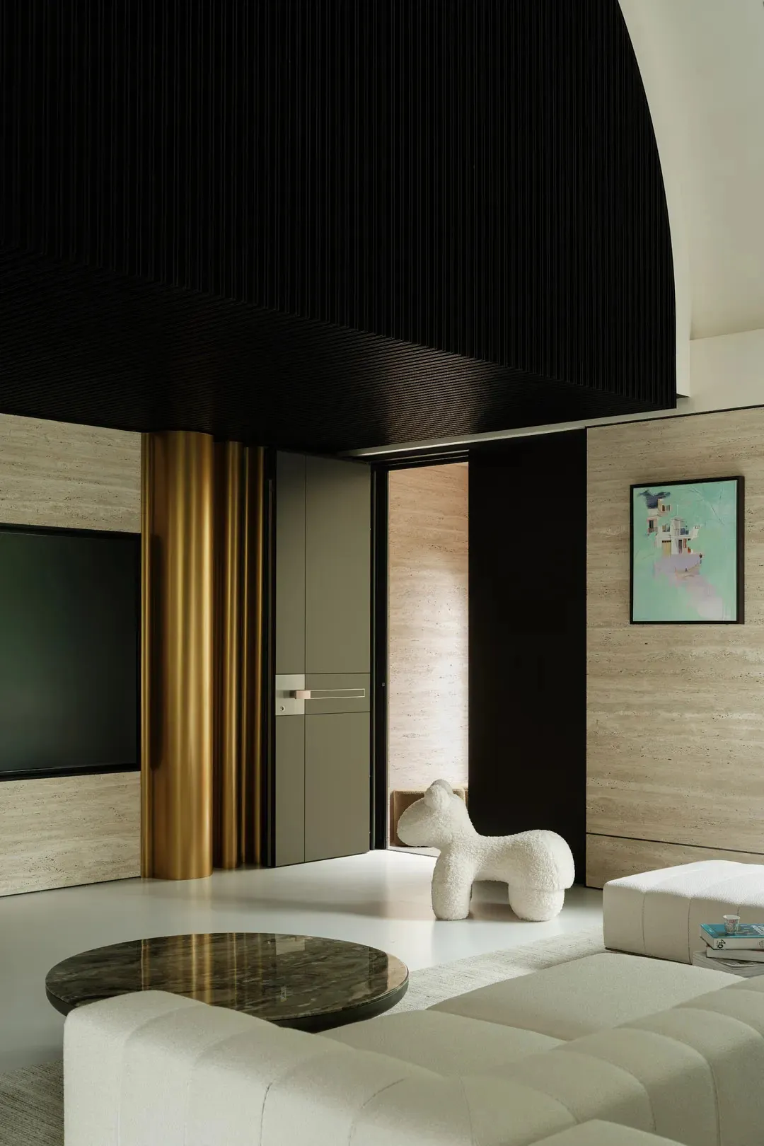 Cozy living space with a white dog, a rug, a flat screen TV, two couches, and a chair