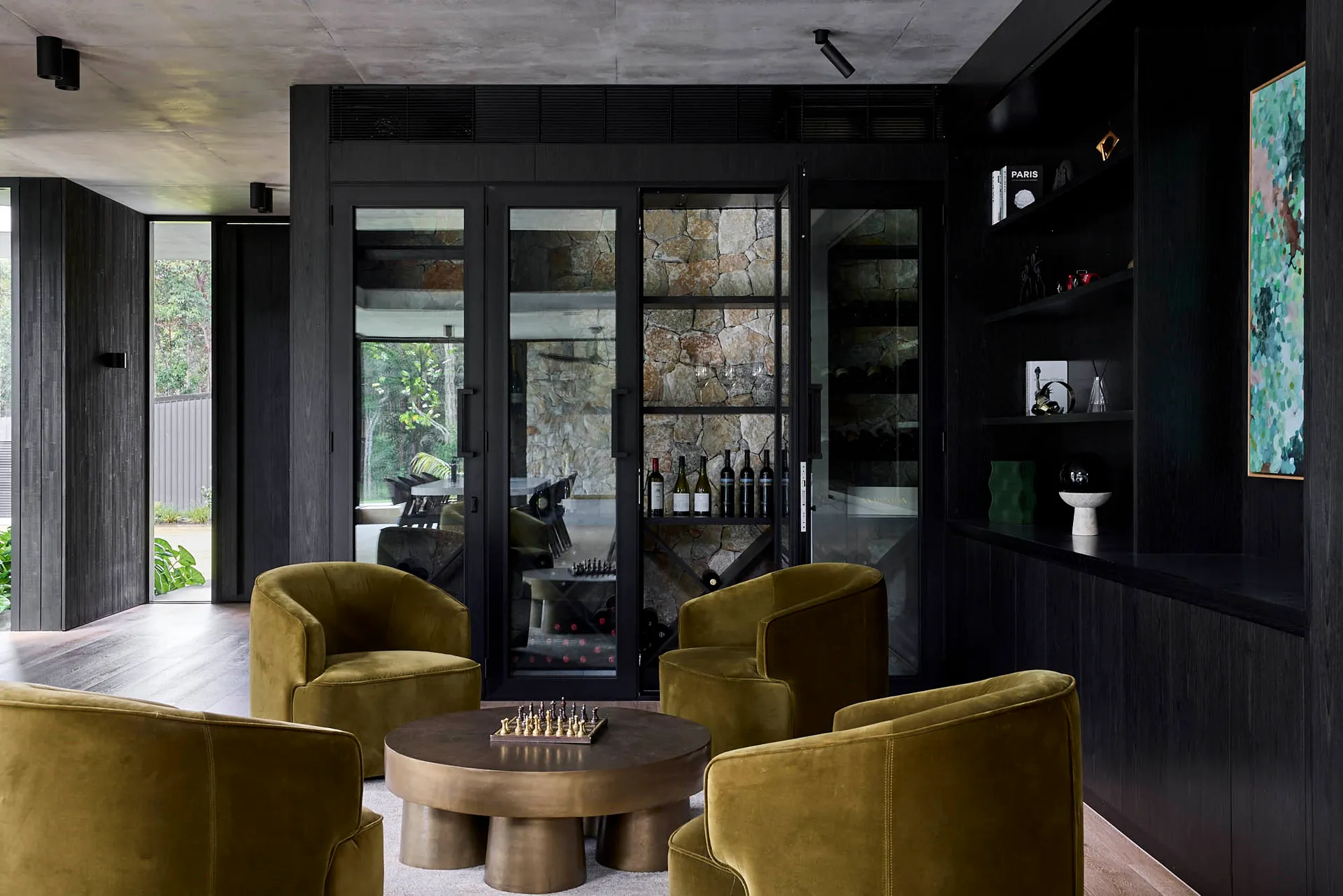 Elegant living room with two couches, chairs, a dining table, decorative elements, and a vase, set in a well-furnished space for relaxation and entertainment