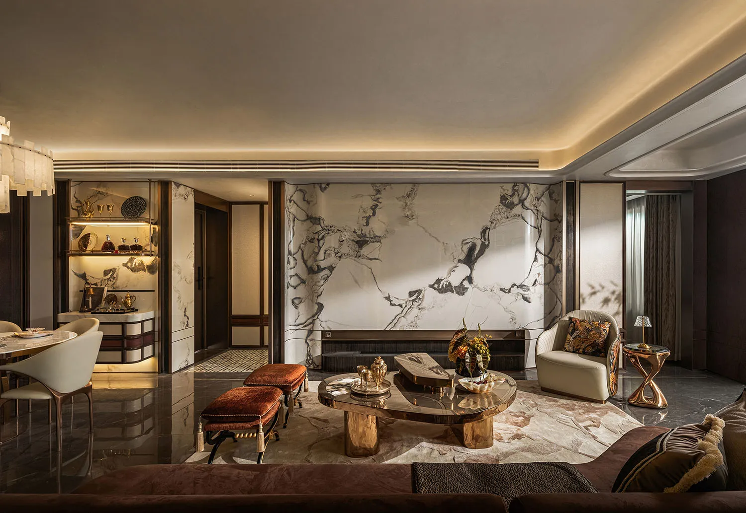 Luxurious living room with a marble floor, a large couch, chairs, and dining tables, complemented by a decorative vase