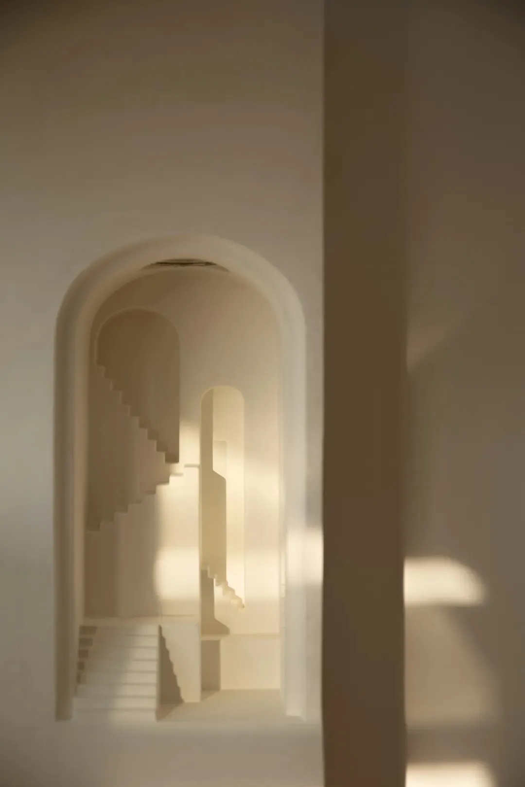 A stone staircase in a church, illuminated by sunlight, with warm shadows and a sense of history