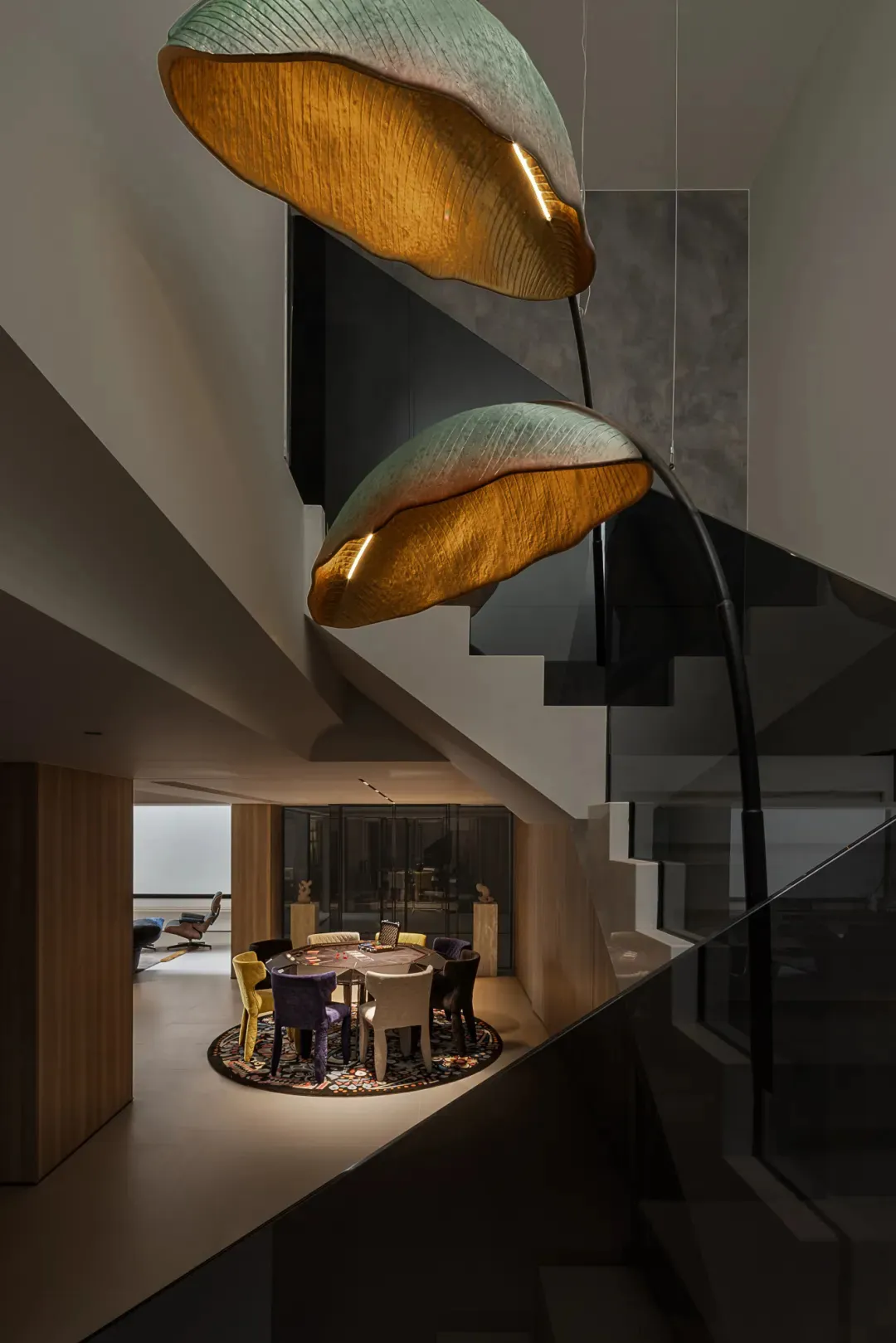 A well-lit living area with a dining table, chairs, and vases, exuding a warm and inviting ambiance