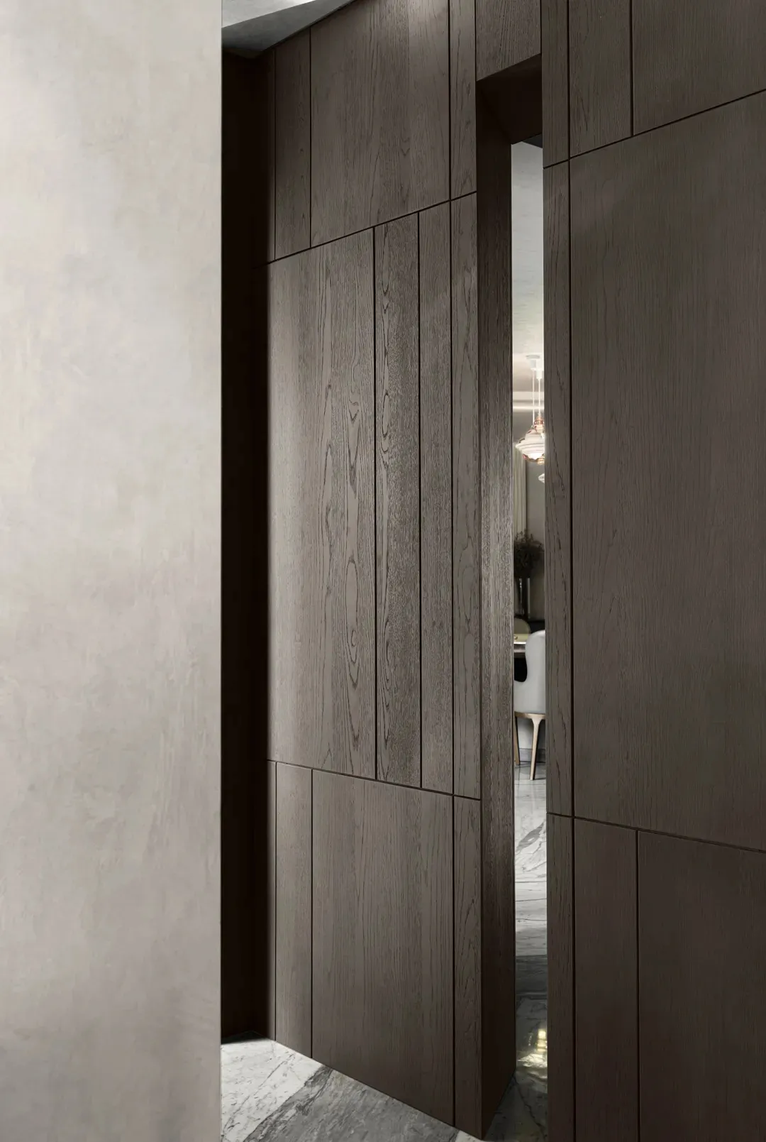 A warm and inviting home entrance with a wooden doorway leading to a dining area with a table and chairs