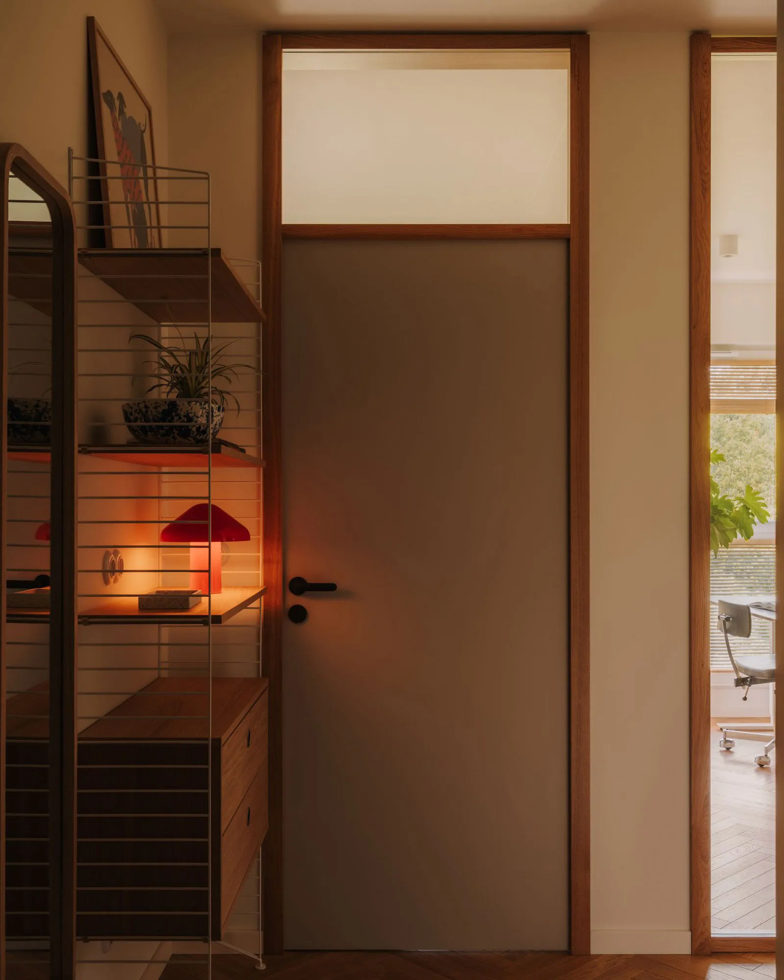 A warm and inviting living space with a doorway, potted plants, and a chair, illuminated by natural light through a glass door window