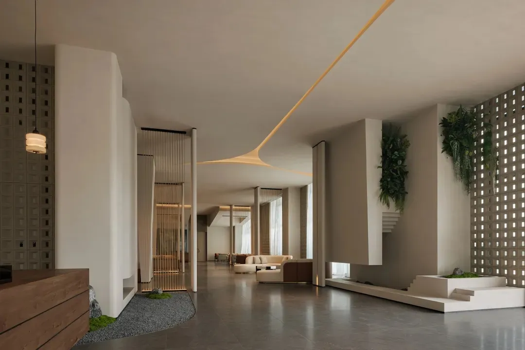 A modern living space with a white color scheme, a large couch, a chair, and a potted plant, well-lit with natural light and decorated with various furniture pieces