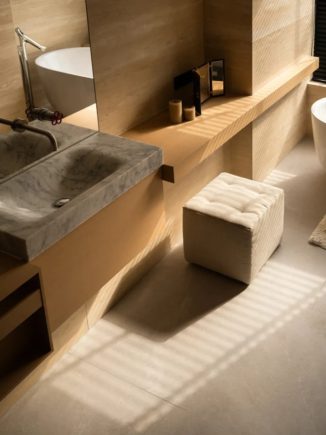 Bathroom with a wooden theme, featuring a sink, toilet, and bathtub, with natural light from the windows