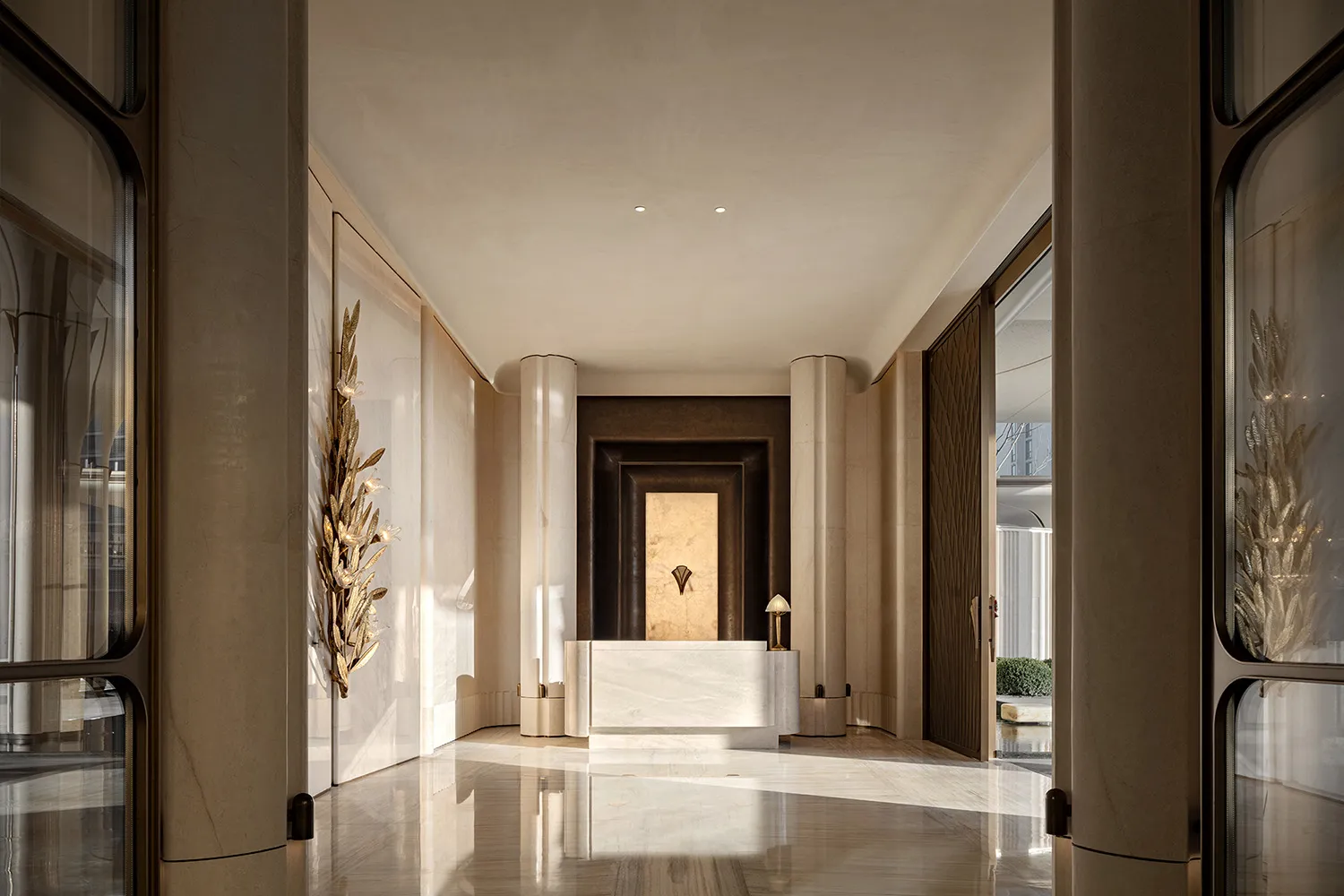 Well-lit lobby with a marble floor, a white desk, and a chair, creating an elegant and inviting atmosphere