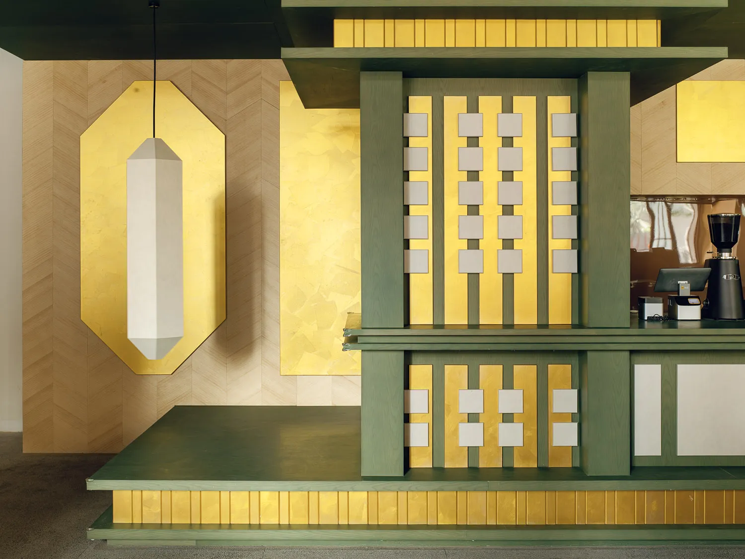 Cozy living room with a green and gold color scheme, featuring a gold wall design, green and gold fireplace, and matching ceiling