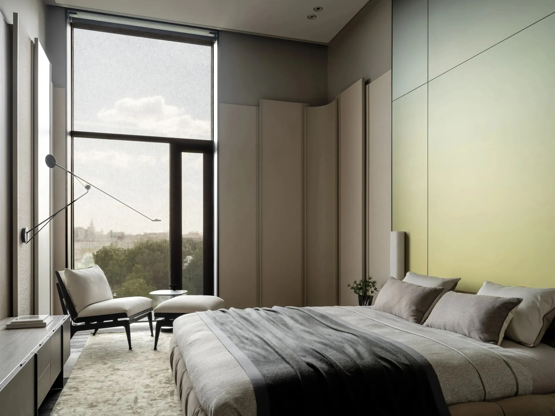 Cozy modern bedroom with a gray bed, chair, and natural light from a large window