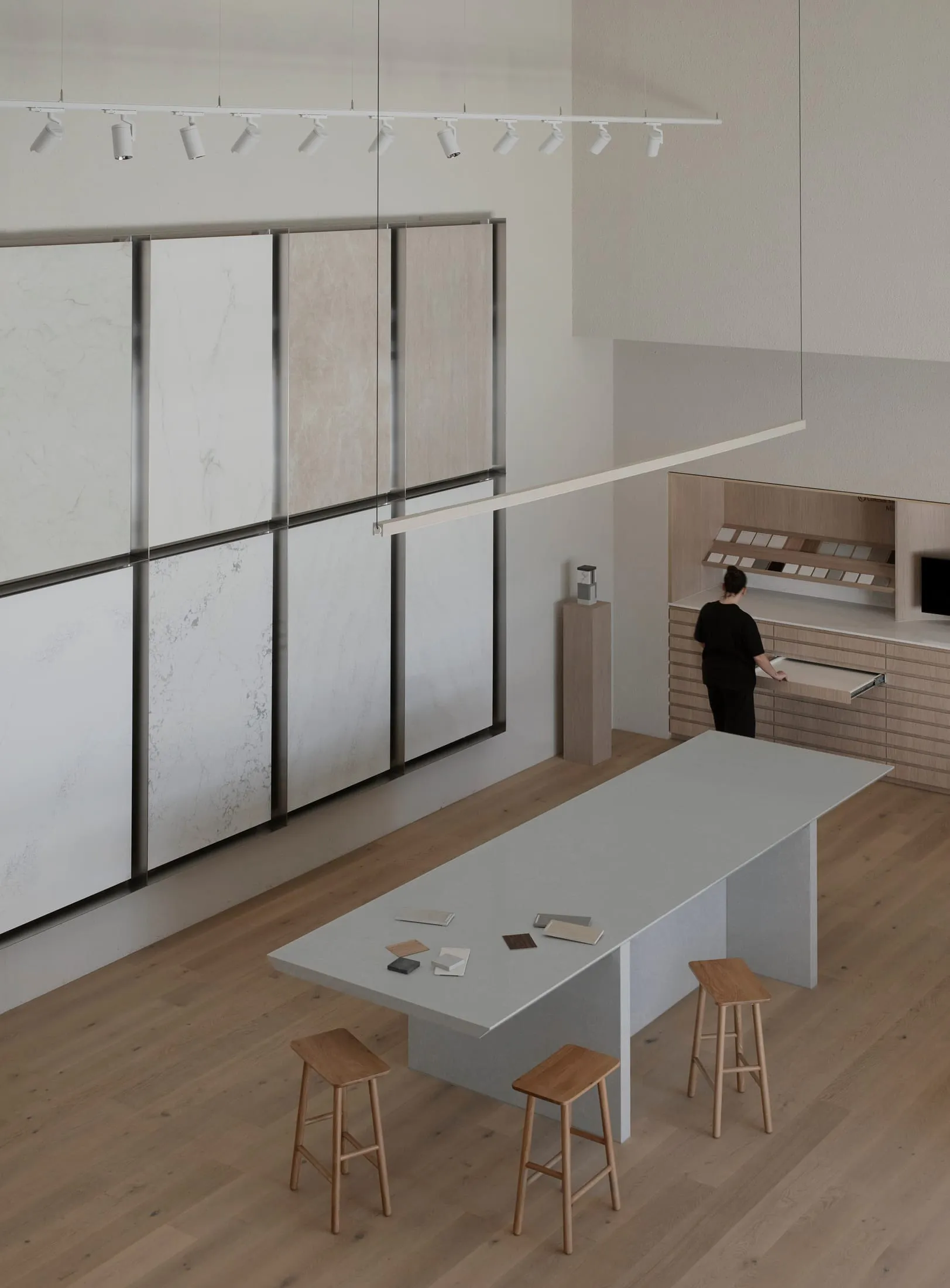 Modern kitchen and dining area with a large island, wooden and marble surfaces, and a clean and organized layout