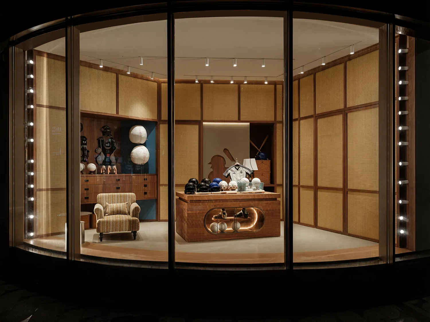A dimly lit store with wooden walls and a glass display case, showcasing a variety of items such as vases, bowls, and a chair