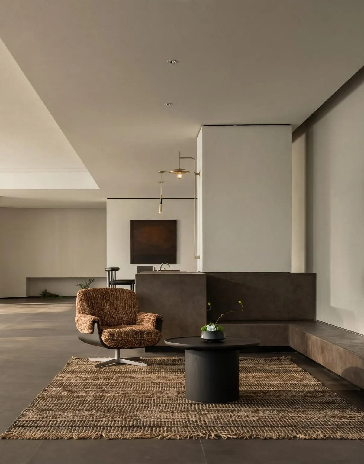 A well-lit living room with a chair, table, and potted plant, featuring wood and glass materials