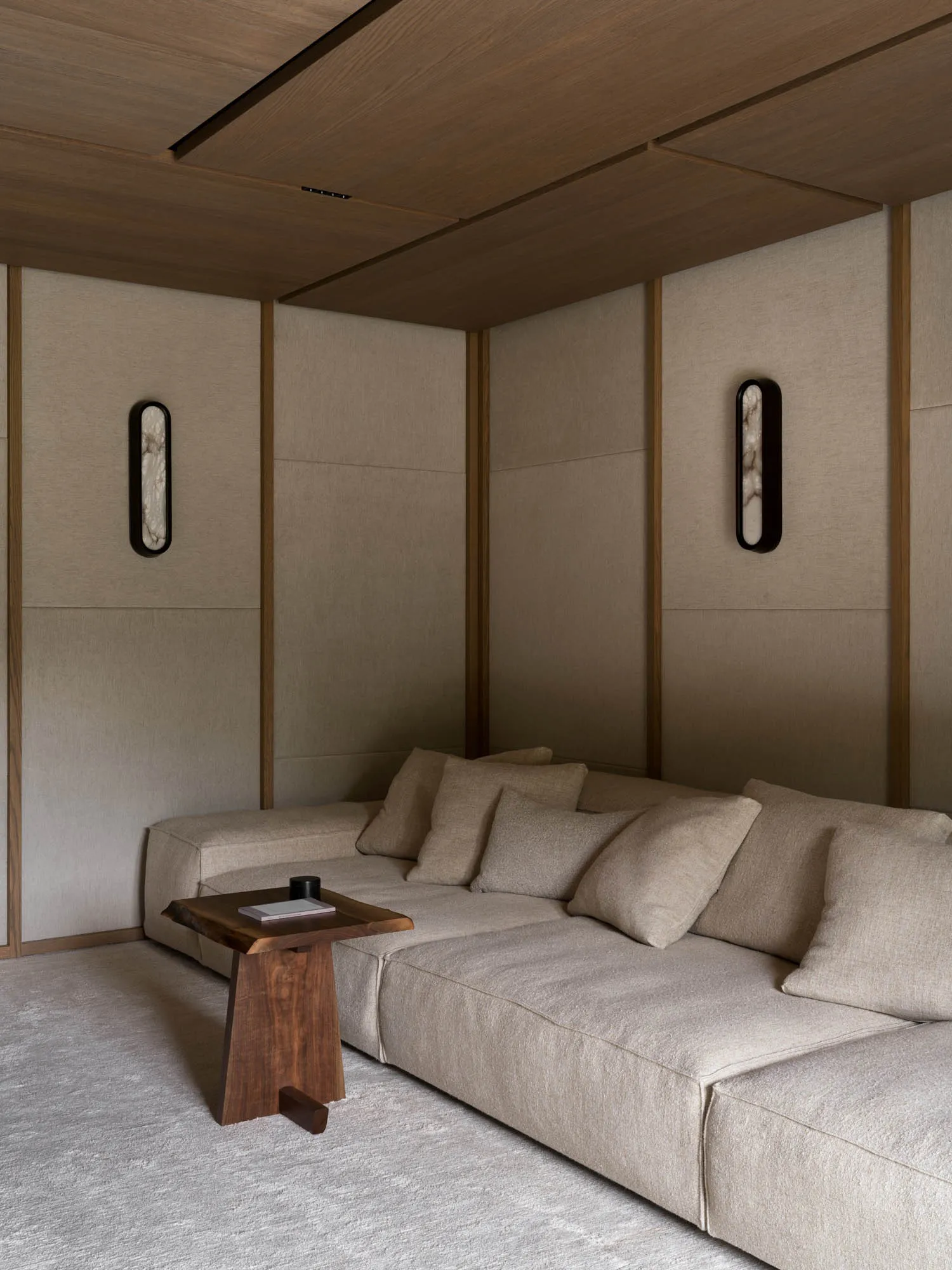 A well-lit living room with a couch, coffee table, and wooden floor, creating a bright and inviting atmosphere
