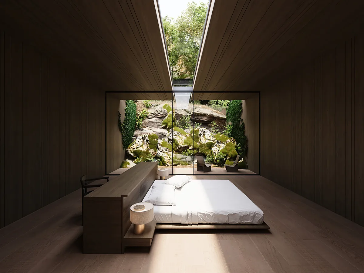 A well-lit bedroom with a wooden floor, a wooden desk, and a bed positioned near a window