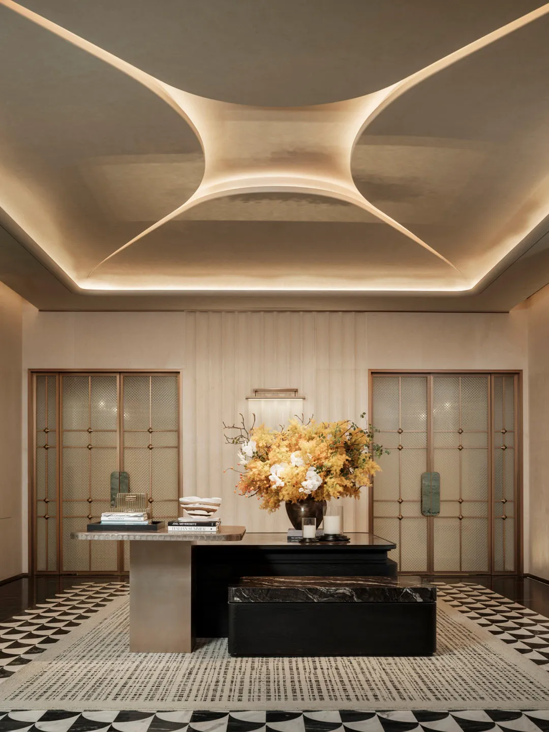 Bright and welcoming lobby with a marble floor, a black desk, and a bookshelf, illuminated by natural light