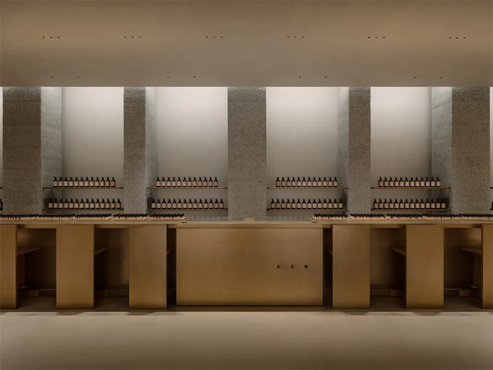 A bright and organized store with rows of bottles on shelves and a counter, creating a welcoming atmosphere for shoppers