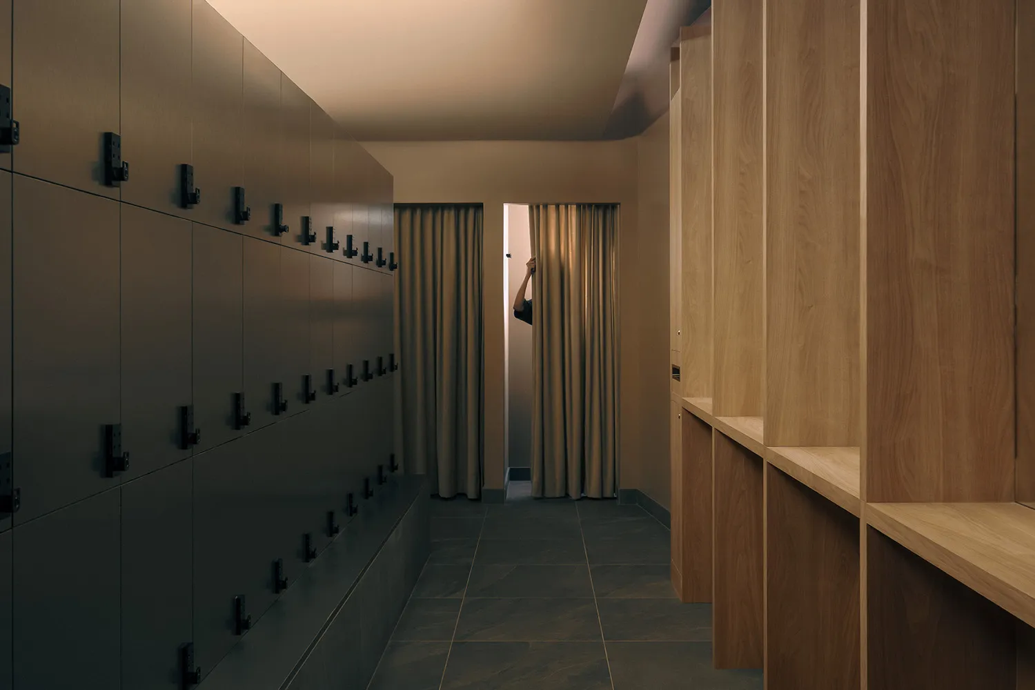 Dimly lit hallway with a door and a window, featuring a minimalist and functional design
