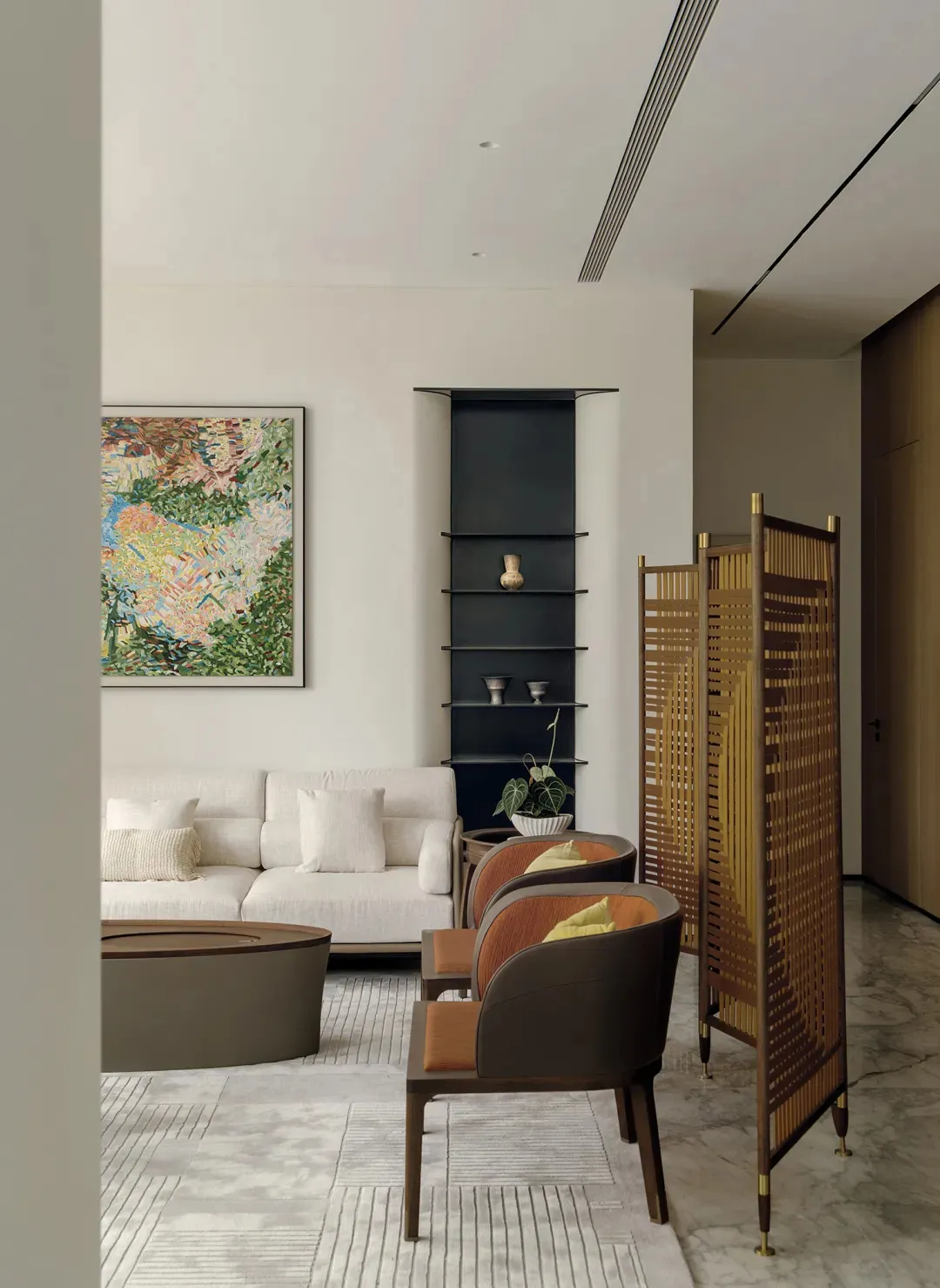 A well-lit living room with a couch, chair, and bench made of wood, decorated with a painting and natural light from windows