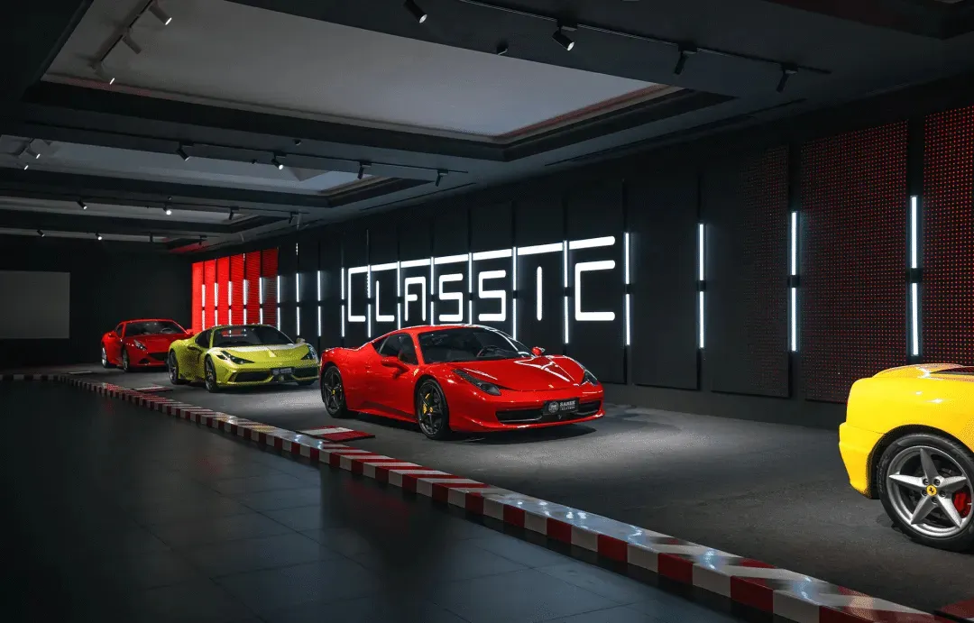 A modern showroom displaying a row of luxury sports cars with a black and red color scheme, vibrant colors, and striking lines