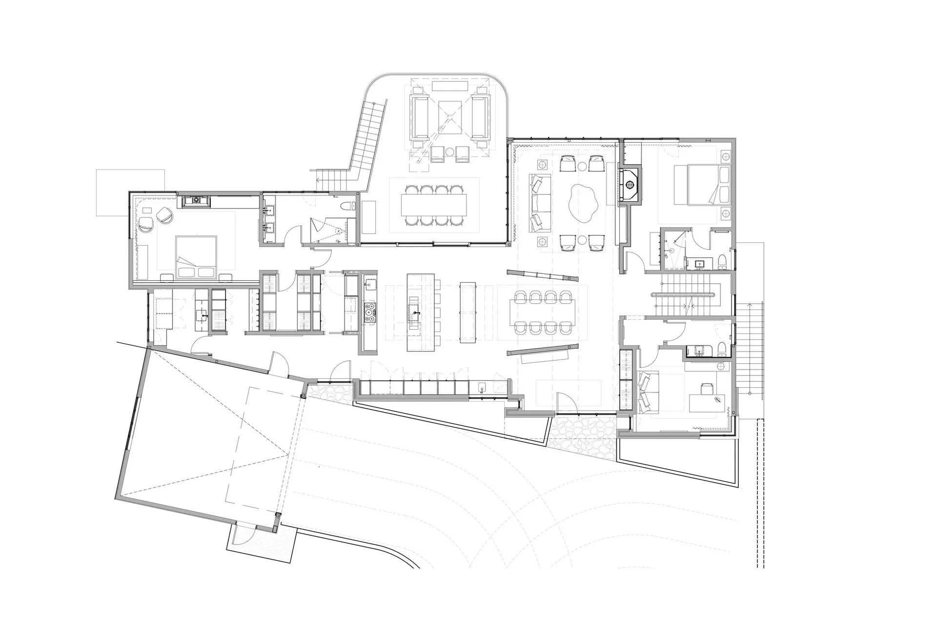 White line drawing of a house floor plan with a large open living space, kitchen, and dining room, and a staircase leading to the upper floor