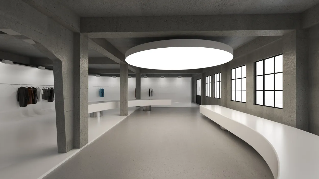 A large, empty lobby with a concrete floor, dimly lit, creating a moody atmosphere
