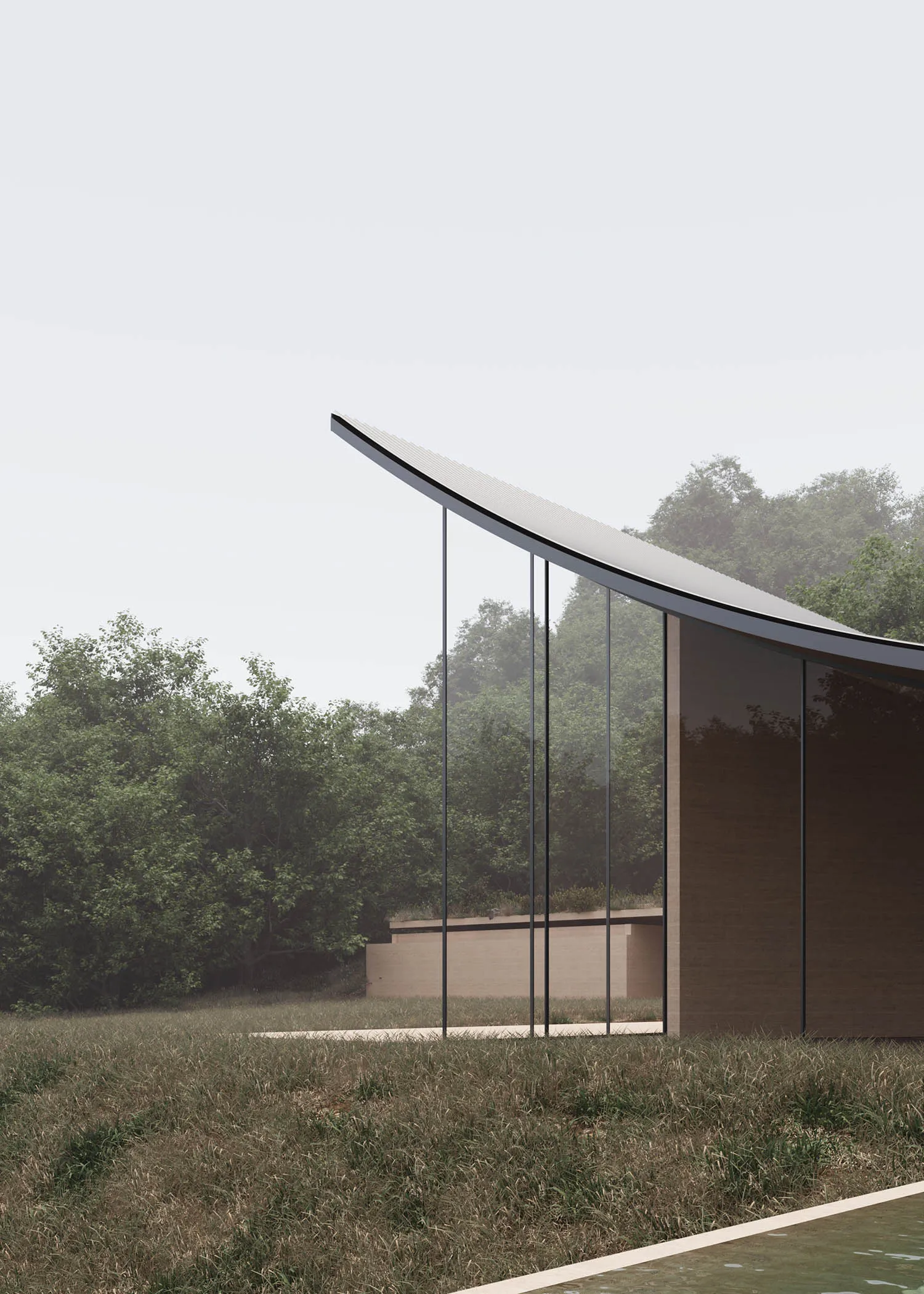 A modern building with a large glass wall, surrounded by a grassy area, with natural light streaming in through the glass wall, creating a bright and inviting atmosphere