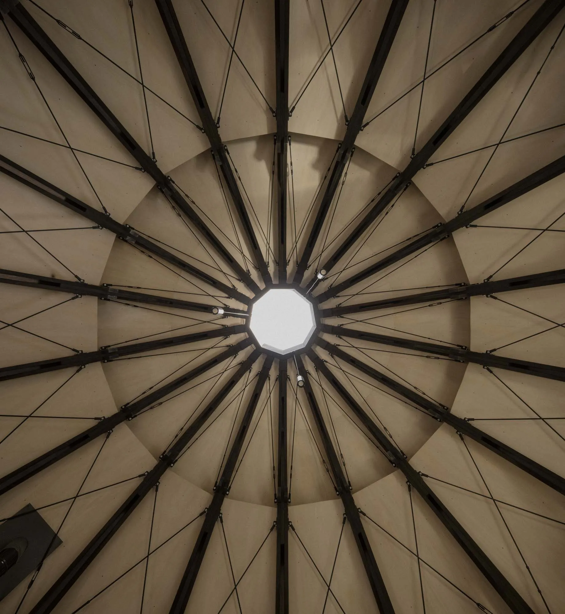 Large, open space with a dome-shaped metal ceiling and natural lighting