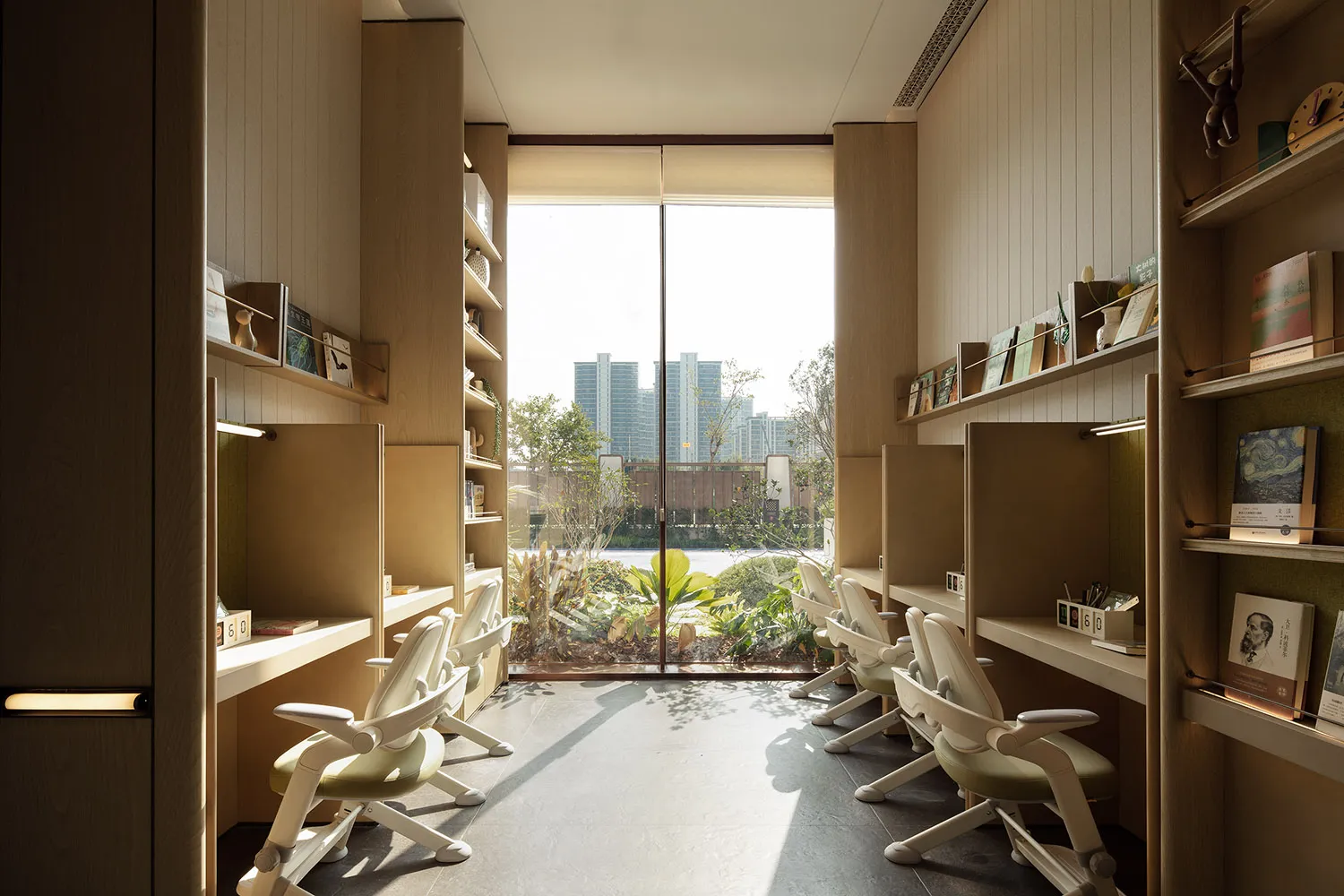 A modern office space with natural light, featuring multiple chairs and a desk, arranged in a comfortable and inviting atmosphere