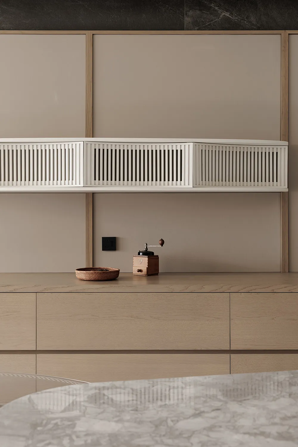 Modern kitchen with wooden cabinets, a white shelf, a bowl, and a coffee maker, with natural light and a bright atmosphere