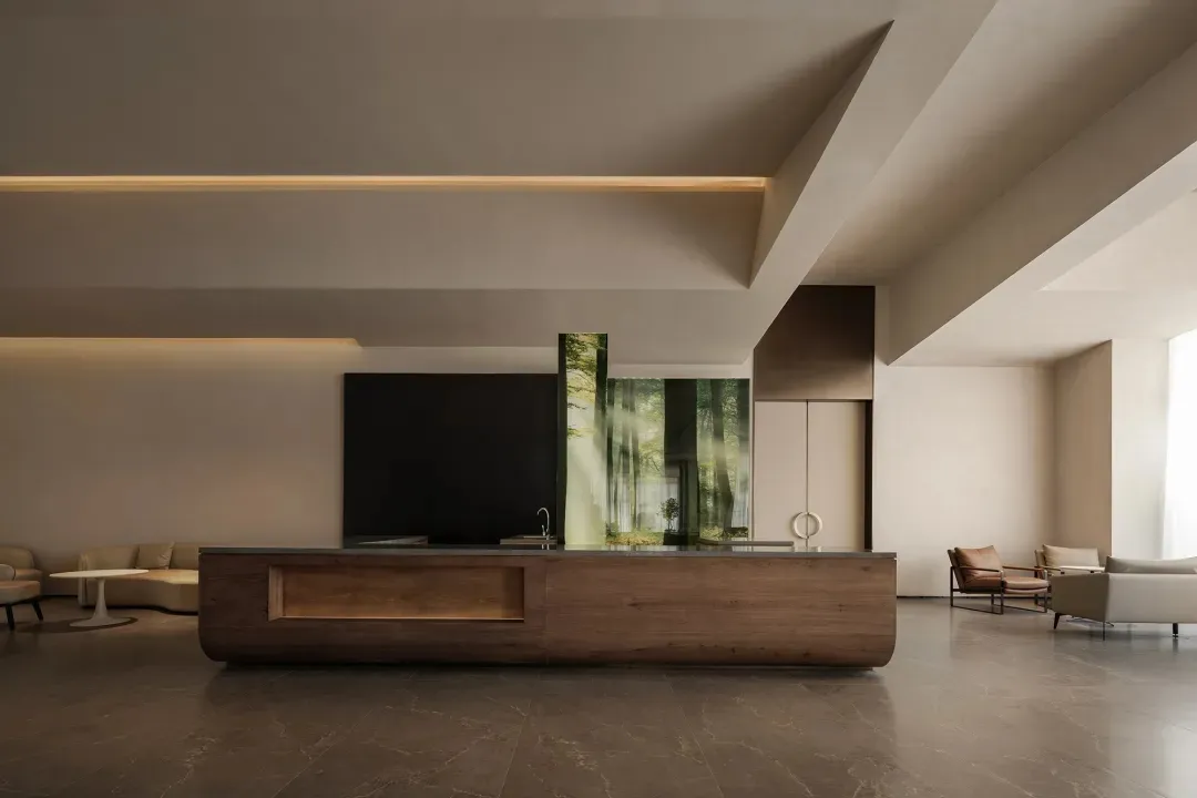 Modern kitchen with a wooden countertop, a black TV, and a dining table, featuring dim lighting
