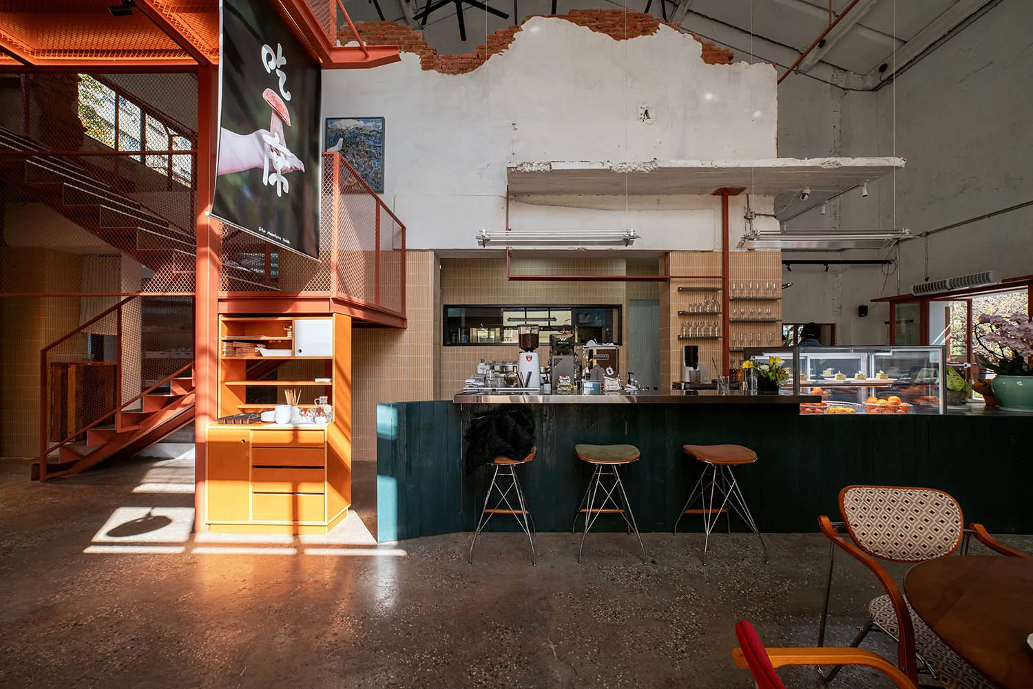 A modern restaurant interior with a bar, chairs, and dining tables, featuring a combination of wood and metal elements, well-lit for a warm and inviting atmosphere