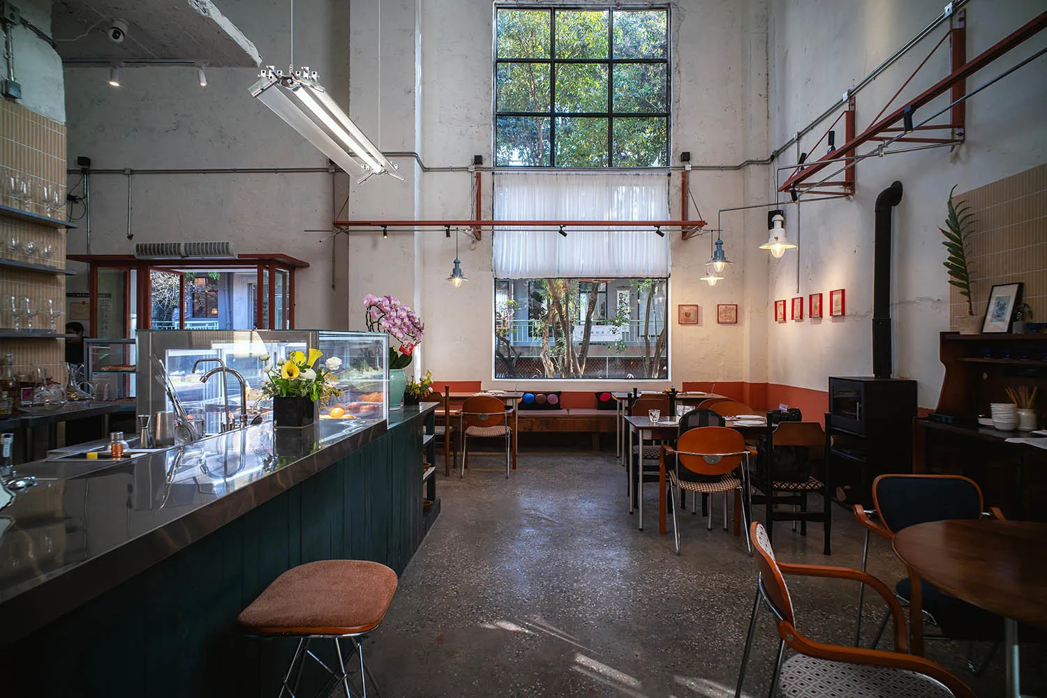 Cozy restaurant interior with wooden accents, metal details, and natural light from a window