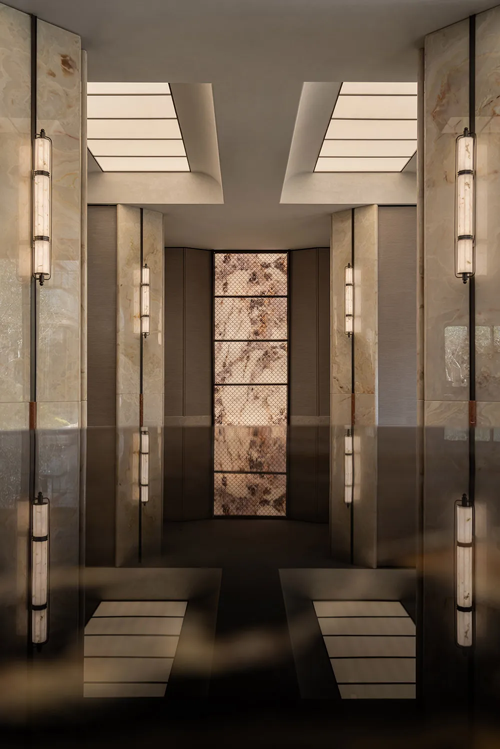 Elegant hotel lobby with marble flooring, well-lit and sophisticated design