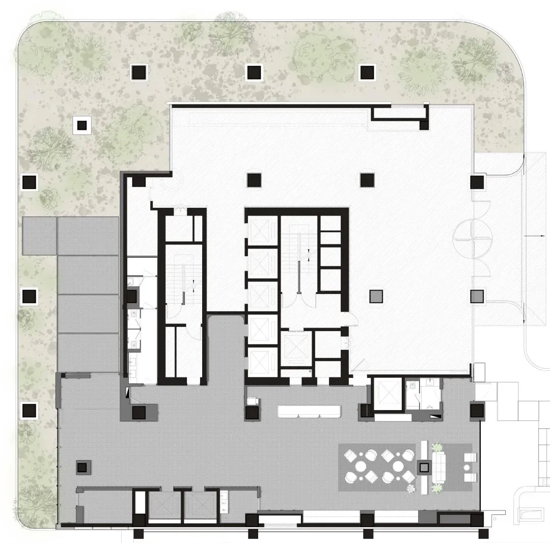 一處現代開放空間，搭配白牆、座椅與餐桌，窗戶引入自然光線