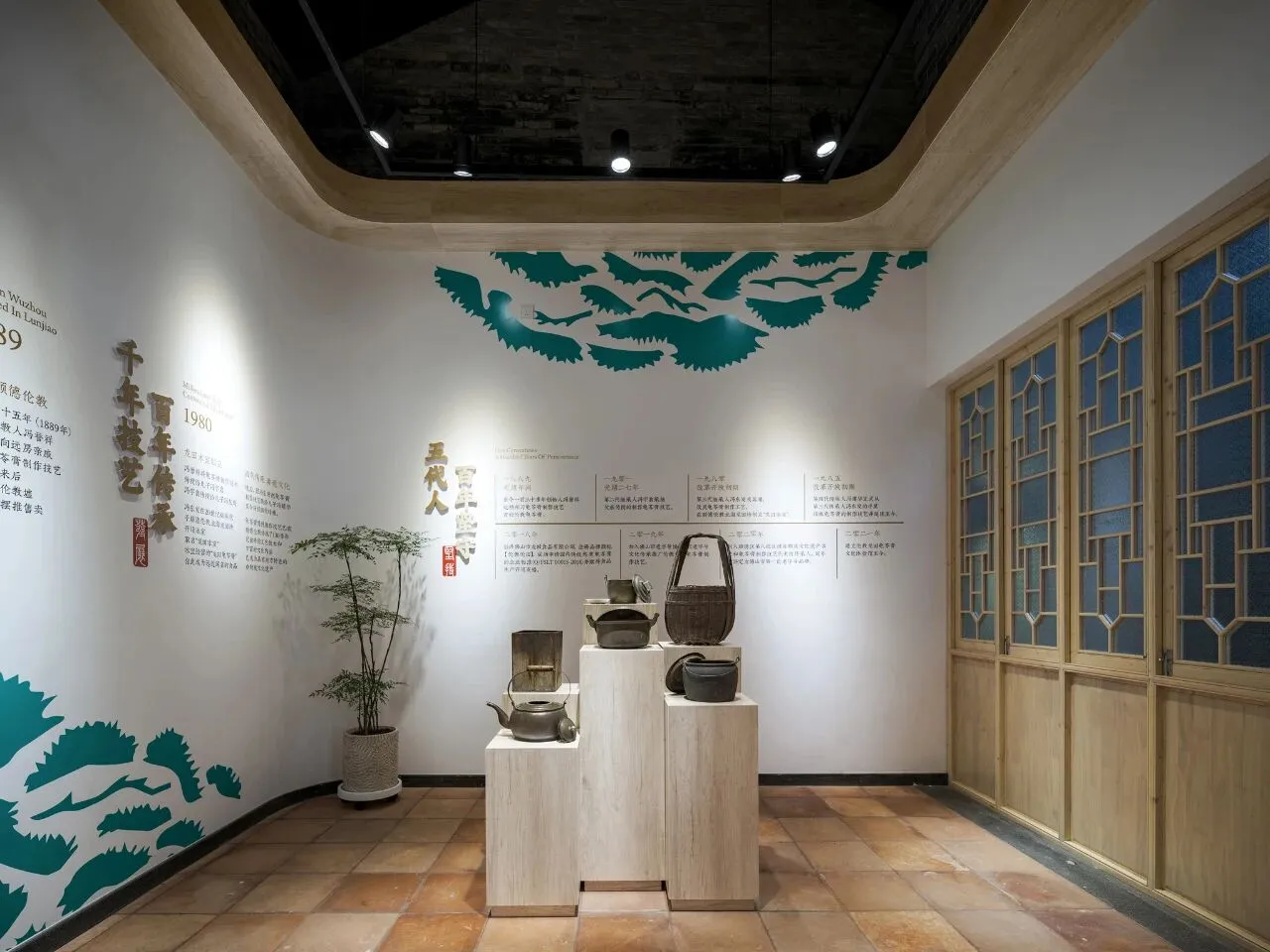 A museum-style room with a pedestal display of vases and baskets on a tile floor, surrounded by a white color scheme and soft diffused lighting
