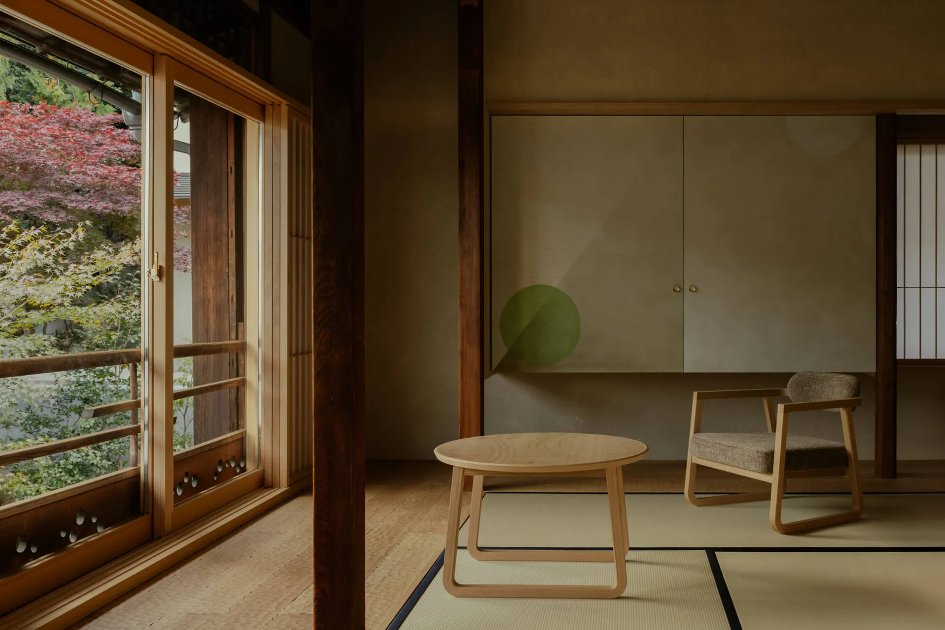 A modern living space with a wooden floor and table, a white wall, and natural light from a window