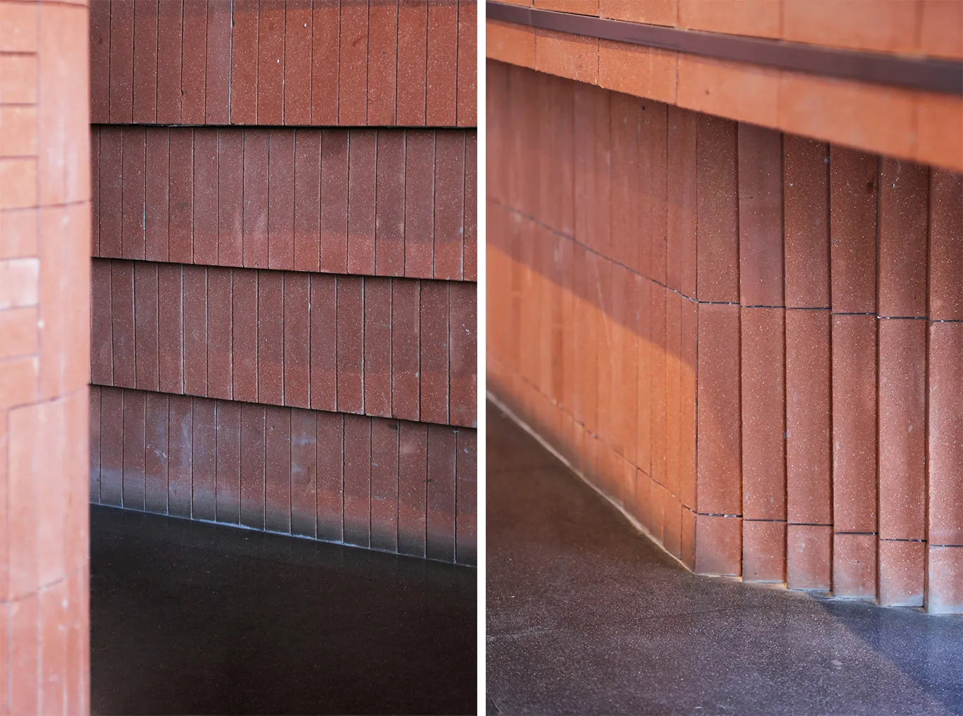 Close-up view of a terracotta brick wall featuring alternating horizontal bands and deep recessed mortar joints, meeting a dark polished floor.