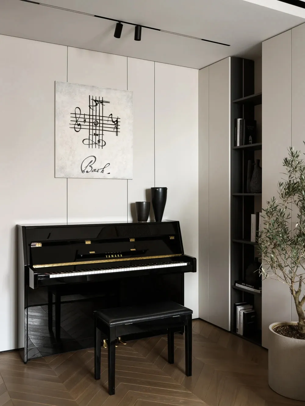 Black Yamaha upright piano with leather bench, Bach music artwork on the wall, built-in shelving, and potted olive tree in a minimalist interior