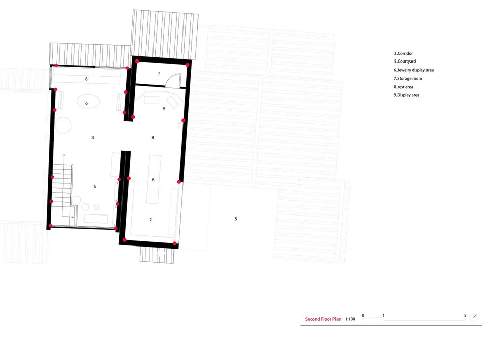 Black and white architectural second floor plan with red dot markers, showing numbered rooms including courtyard, jewelry display area, storage room, rest area and display area at 1:100 scale.