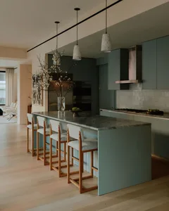 Contemporary kitchen with concrete countertop and bar stools