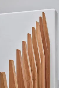Minimalist design featuring tall wooden structures against a white background