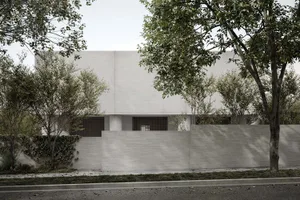 現代極簡住宅建築立面採用混凝土材質，搭配大面窗與白色外觀。