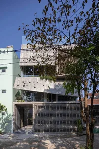 Modern house exterior featuring concrete and glass materials