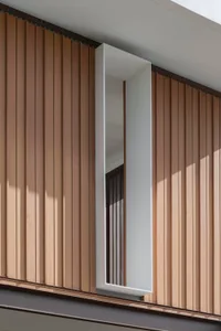 A modern interior space featuring wooden paneled walls.