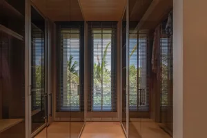 Modern interior design featuring glass door wardrobe.
